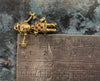 Gold pendent doll
