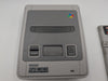 Super Nintendo console w/games