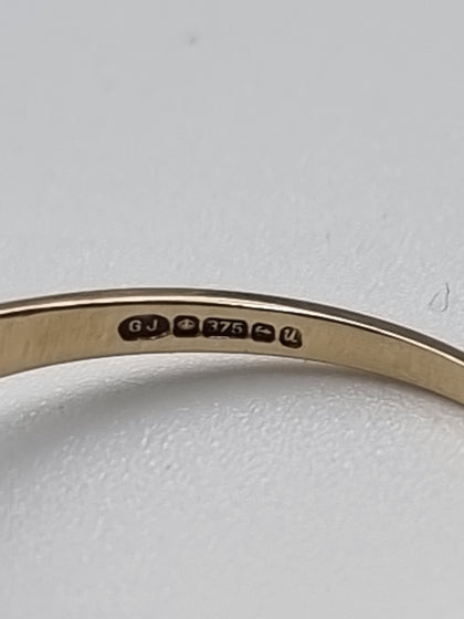 9CT Yellow Gold Ring With Black Stone And Diamond Stones - Size S - 2.43 Grams