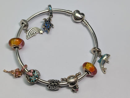 silver pandora bangle with 9 charms