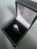 18ct GOLD RING WITH WHITE STONES 2.2G 750 Size L