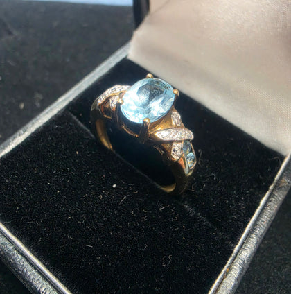 9ct Gold Ring (light blue stone)375 2.9G Size M