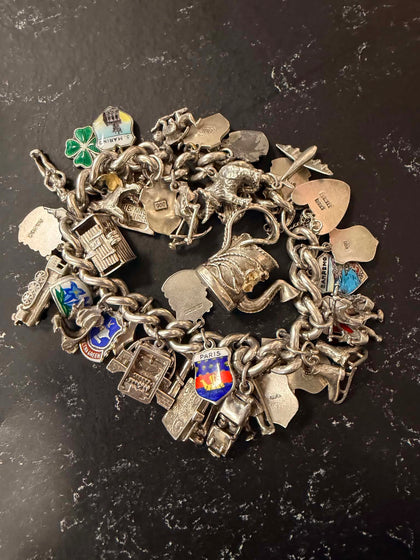 Silver vintage charm bracelet 117g with 30 plus charms