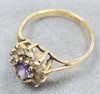 9ct gold ring with clear & purple stone