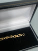 10.3G 9ct gold bracelet child's, 375 6"
