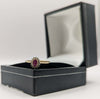 9CT HALLMARKED 375, YELLOW GOLD, RING WITH RED STONE EMBEDDED, SIZE I, 1.6G, BOXED