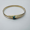 14CT GOLD BANGLE WITH BLUE STONE