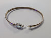 9ct gold bangle with light blue centre stone