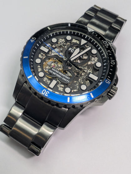FOSSIL SKELETON WATCH WITH TIN PRESTON STORE