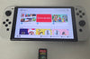 Nintendo Switch OLED Edition - White & 1 Unboxed Game