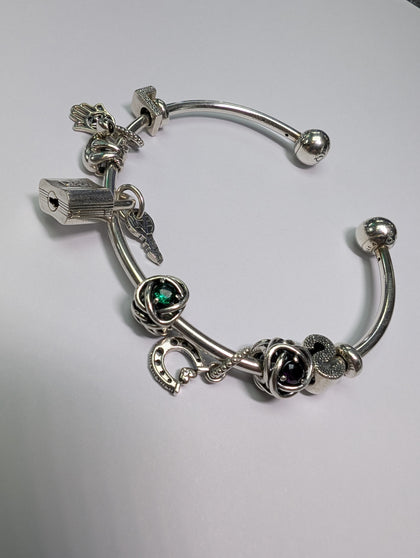 SILVER PANDORA BANGLE WITH CHARMS PRESTON  STORE