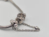 Pandora bracelet with flowered safety chain and heart charm