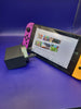 Nintendo Switch Console with Orange / Purple Joycons