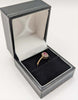 9CT HALLMARKED 375, YELLOW GOLD, RING WITH RED STONE EMBEDDED, SIZE I, 1.6G, BOXED