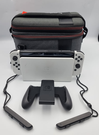 Nintendo Switch OLED 64GB white/black handheld console with hdmi dock. Original charger and joy-con cradle. Comes with carry case