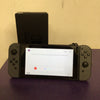 Nintendo Switch with dock and cables.