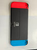 nintendo switch oled boxed red and blue joycon