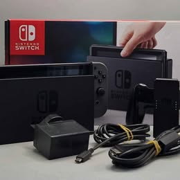 Nintendo Switch Grey Boxed With Joycons And Wires has some light scratches on the screen dose not affect the use