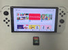 Nintendo Switch OLED Edition - White & 1 Unboxed Game