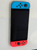 nintendo switch oled boxed red and blue joycon