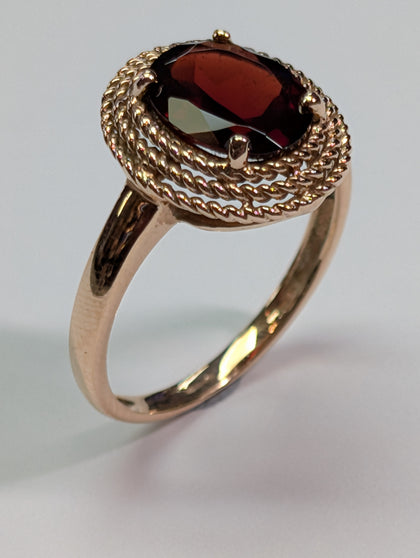 9ct gold rope mount style ring with large red stone