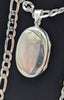 925 HALLMARKED SILVER, LOCKET ON A FIGARO CHAIN, 22", 32.2G