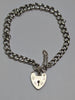 SILVER CHARM BRACELET WITH HEART LOCK