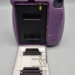 Fujifilm Instax Mini 9 Instant Camera Purple Battery operated and has no photo carts but has been tested and fully works