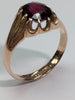 9ct gold ring with large red centre stone