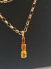 hallmarked 9k gold  16" necklace with 3 amber pieces 3.8 grams . box included