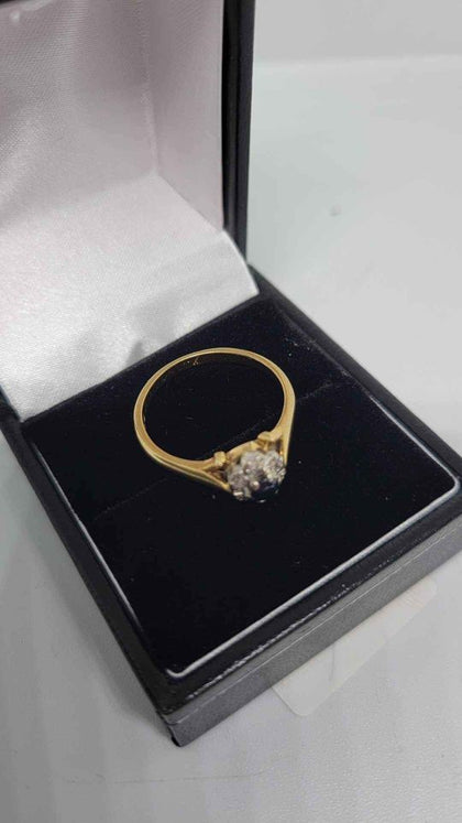 18ct Yellow Gold Ring With Black Stone Surronded By Clear Stones (Not Dia) - Size O - 3.43 Grams.