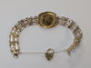 22ct Gold Half Sovereign 1982 on 9ct 5 bar gate bracelet.
