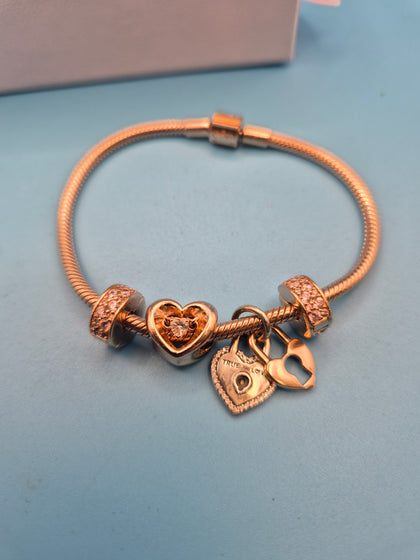 Pandora rose gold bracelet and charms