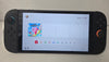 Nintendo Switch 2 Console with one boxed and 0ne unboxed game