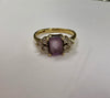 9CT GOLD RING WITH PURPLE/CLEAR STONES SIZE J 1/2 LEYLAND STORE