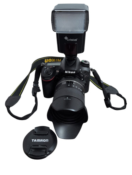 nikon d7100 with tamron 16-300mm lense and flash