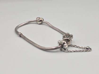 Pandora bracelet with flowered safety chain and heart charm