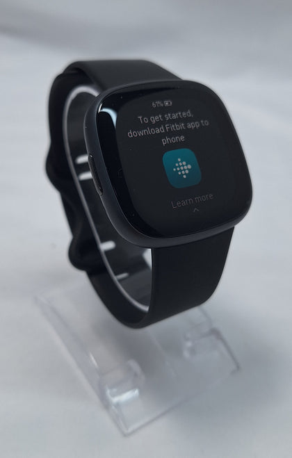 Fitbit Versa 4 solid black fitness band/watch boxed with original charger