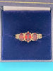 9ct gold ring with red stones (S)