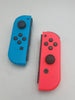 Nintendo Switch 32GB handheld console with red/blue joycons, dock and charger UNBOXED