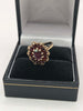 9k Hallmarked gold ring , red stone flower - 3.7 grams size o