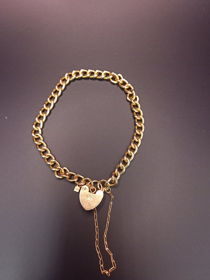 12.8G 9 CT Yellow gold curb bracelet with a heart padlock clasp & safety chain