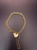 12.8G 9 CT Yellow gold curb bracelet with a heart padlock clasp & safety chain