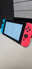 Nintendo Switch Console, 32GB + Neon Red/Blue Joy-Con