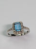 9CT WHITE GOLD DIAMOND & BLUE STONE RING