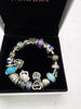 pandora ' golden snitch'  charm bracelet with 15 charms , silver (925) 54.5 grams