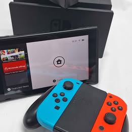 Nintendo Switch Neon 32gb console with all parts shown unboxed some slight damage to upper edge