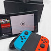 Nintendo Switch Neon 32gb console with all parts shown unboxed some slight damage to upper edge