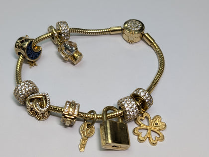 PANDORA GOLD COLOURED CHARM BRACELET WITH CHARMS PRESTON STORE