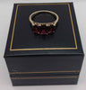 9ct 375 yellow gold ring with dark purple stones 2.58g Boxed size O